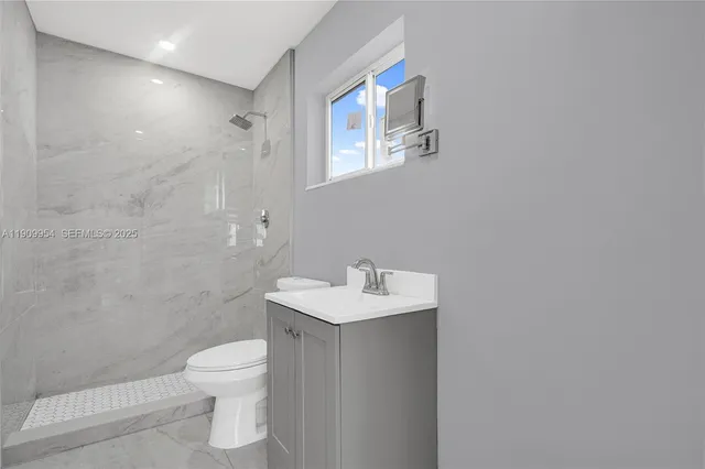a view of hallway with wooden floor