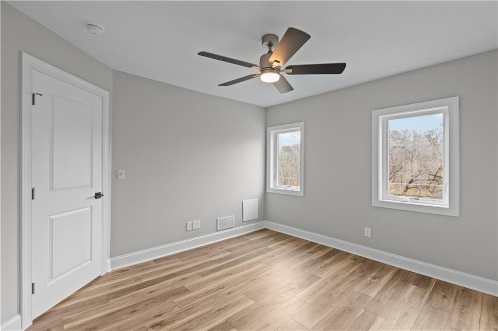 817 Eldora Place Pittsburgh, PA 15210 - Photo 17 of 29 a view of empty room with wooden floor and fan