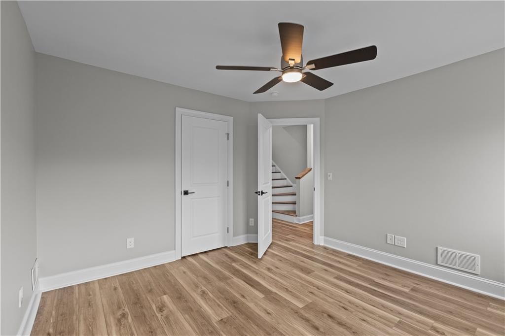 817 Eldora Place Pittsburgh, PA 15210 - Photo 18 of 29 a view of empty room with wooden floor and ceiling fan