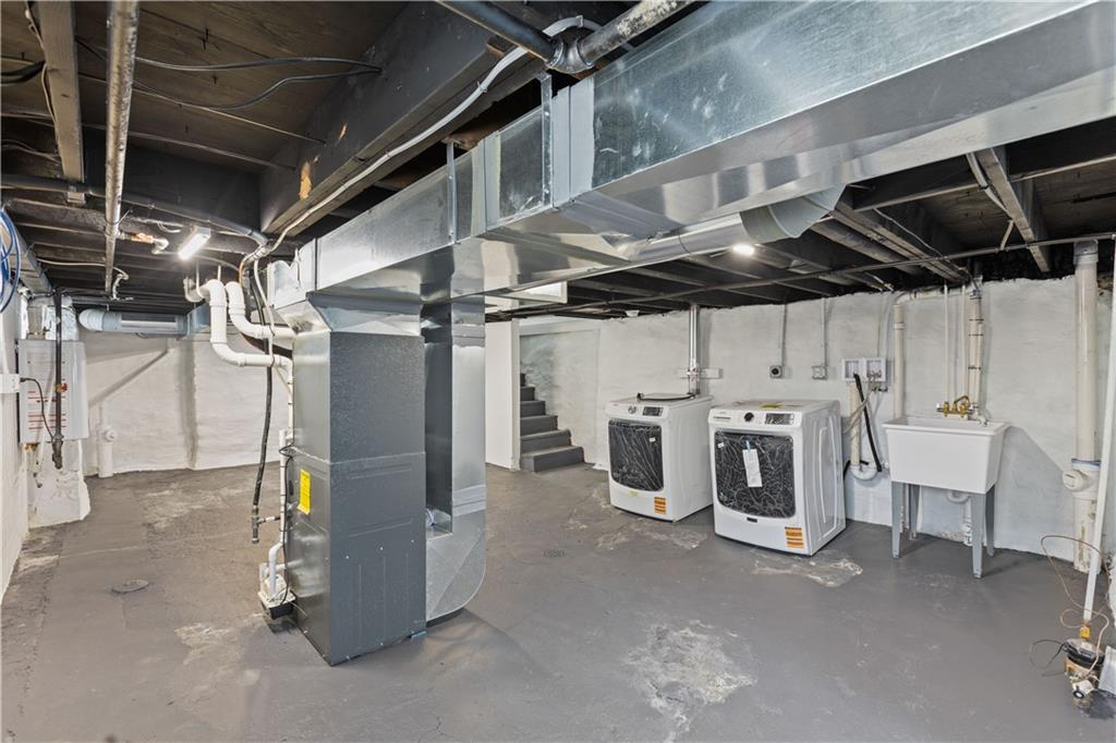 817 Eldora Place Pittsburgh, PA 15210 - Photo 25 of 29 a utility room with dryer and washer