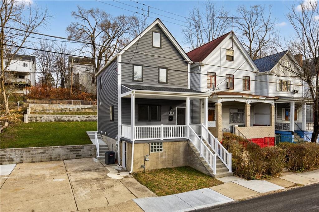 817 Eldora Place Pittsburgh, PA 15210 - Photo 3 of 29 a front view of a house with garden