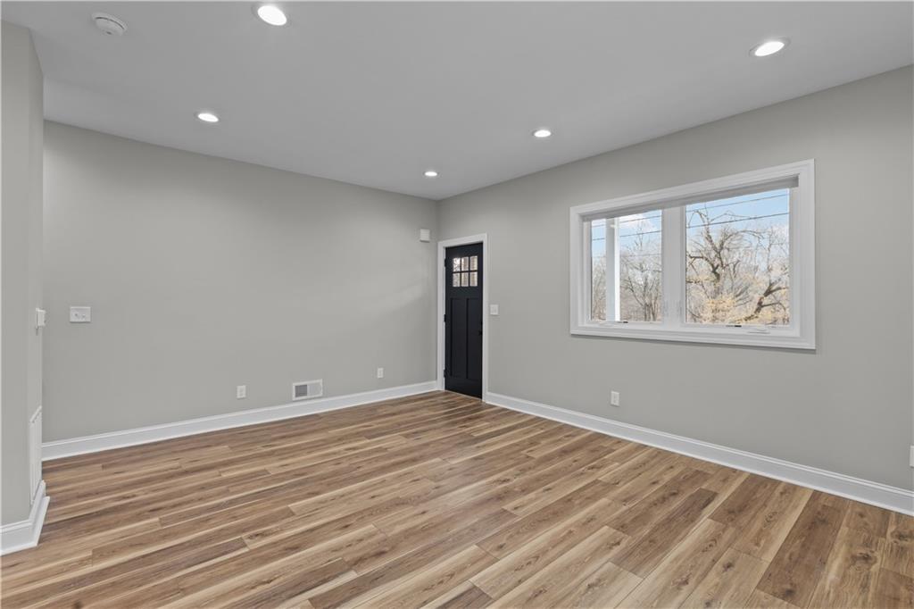 817 Eldora Place Pittsburgh, PA 15210 - Photo 6 of 29 a view of room with window and wooden floor