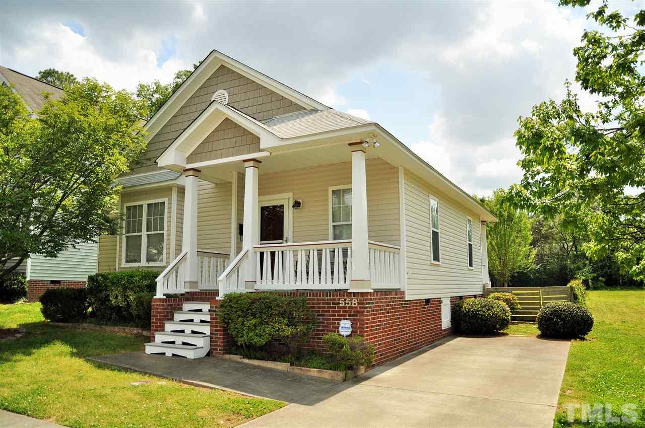 558 East Martin Street Raleigh, NC 27601 - Photo 2 of 24 a view of house with yard and sitting area