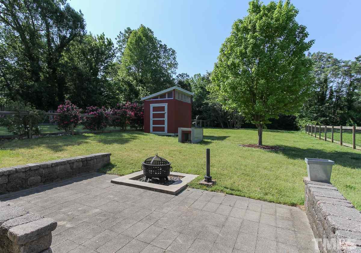 558 East Martin Street Raleigh, NC 27601 - Photo 20 of 24 a view of a garden with a lake