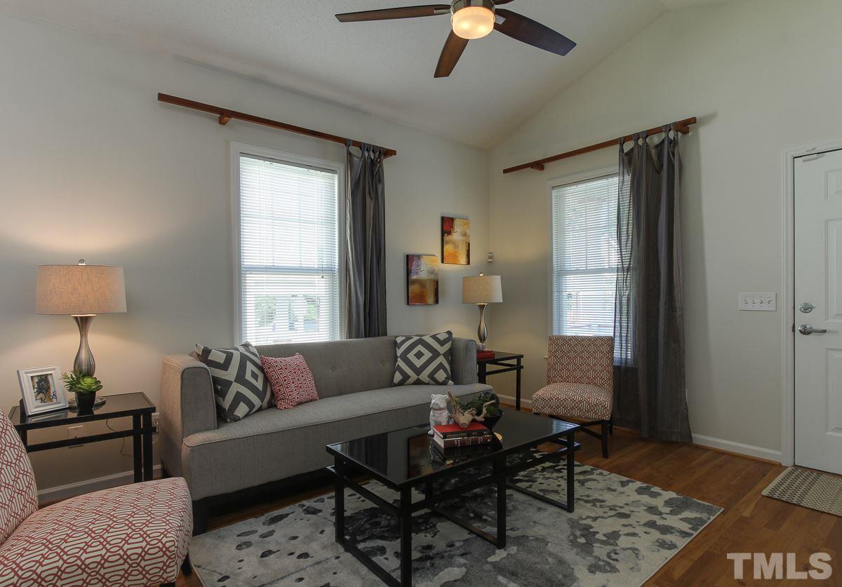 558 East Martin Street Raleigh, NC 27601 - Photo 4 of 24 a living room with furniture and a window