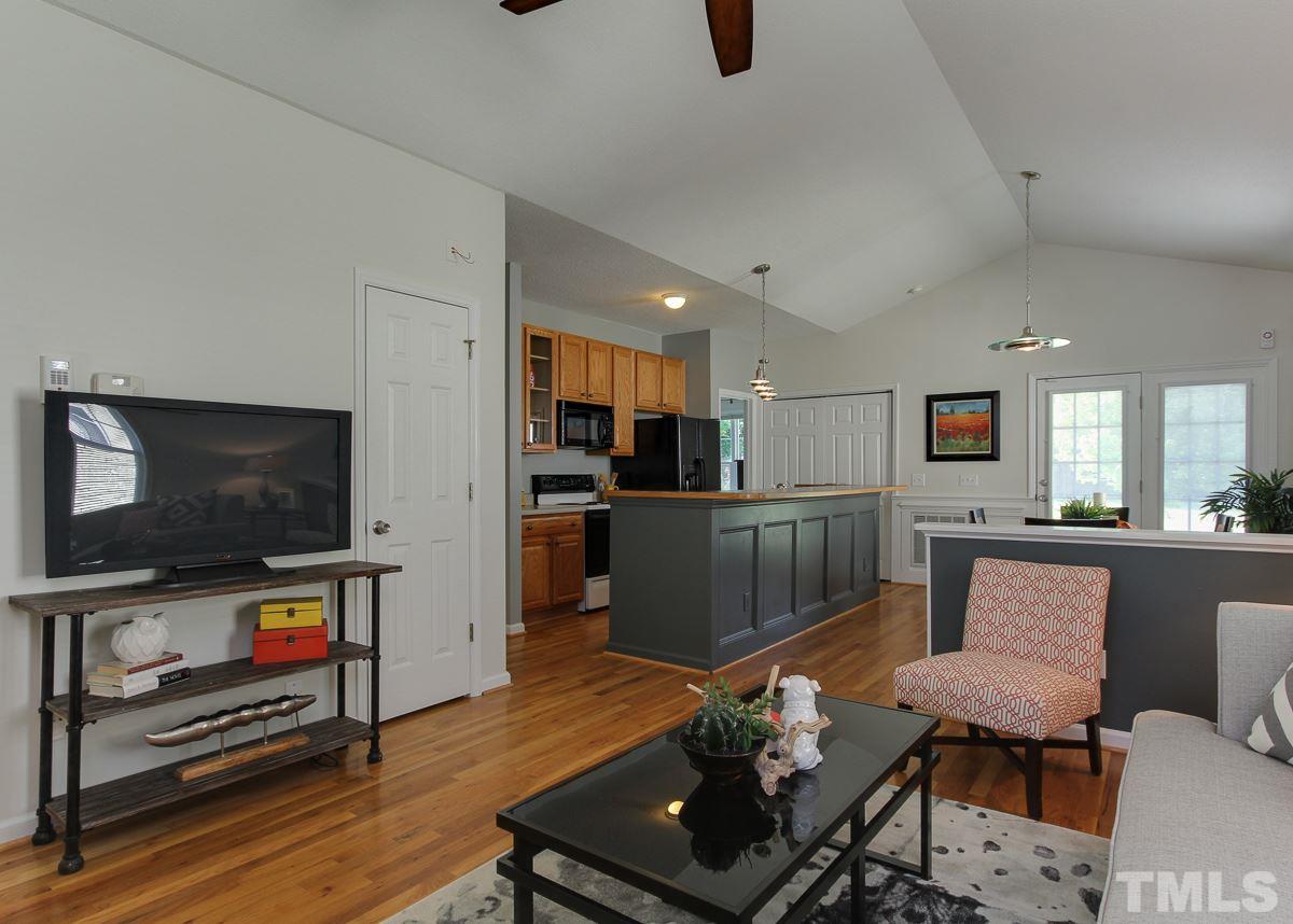 558 East Martin Street Raleigh, NC 27601 - Photo 5 of 24 a living room with furniture and a flat screen tv