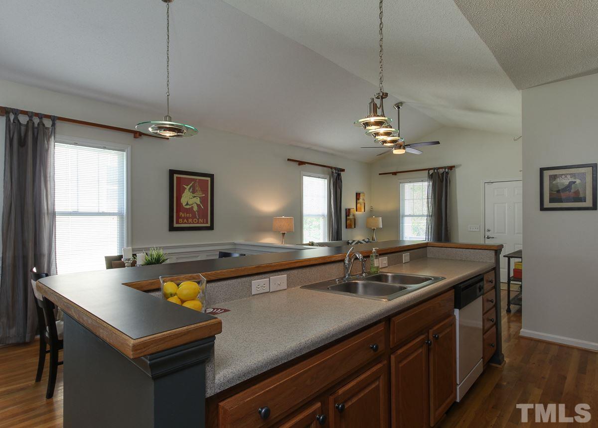558 East Martin Street Raleigh, NC 27601 - Photo 8 of 24 a kitchen with a sink appliances and a counter top space