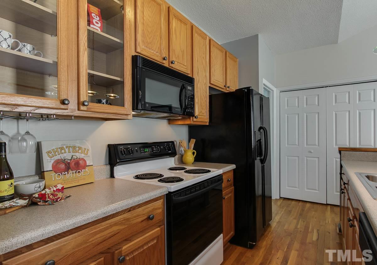 558 East Martin Street Raleigh, NC 27601 - Photo 9 of 24 a kitchen with stainless steel appliances a stove microwave and refrigerator