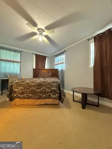 a white toilet sitting next to a shower curtain