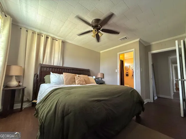 a bedroom with a bed and a sink