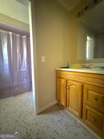 a bedroom with a bed and a flat tv screen