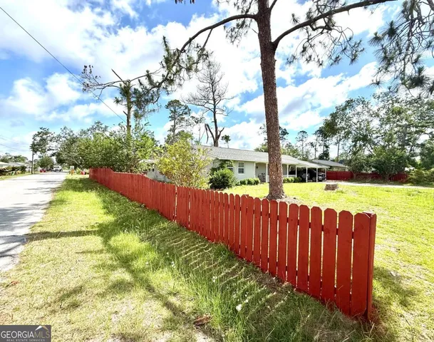 a view of a playground with basketball court