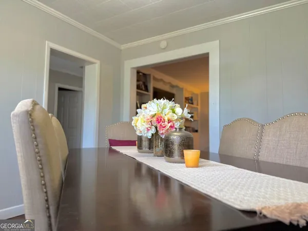 a view of living room with furniture and flower pot