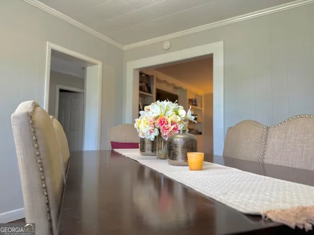 a view of living room with furniture and flower pot
