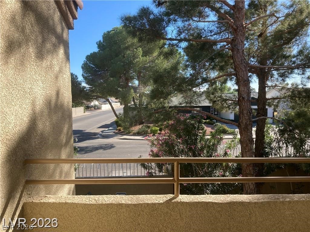 3145 East Flamingo Road, Unit 2100 Las Vegas, NV 89121 - Photo 26 of 34 Enjoy views of verdant trees and the quiet neighborhood from this private balcony.