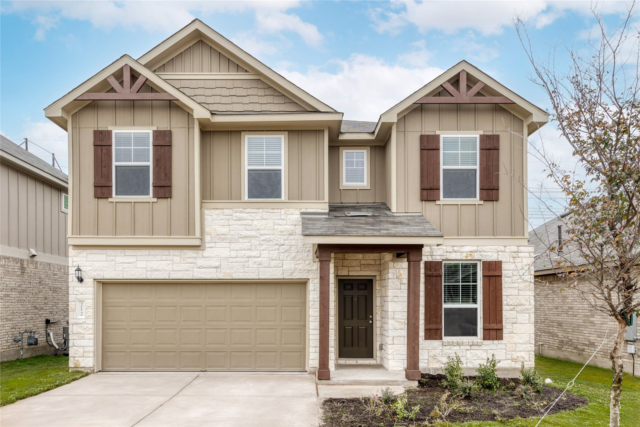 a front view of a house with a yard