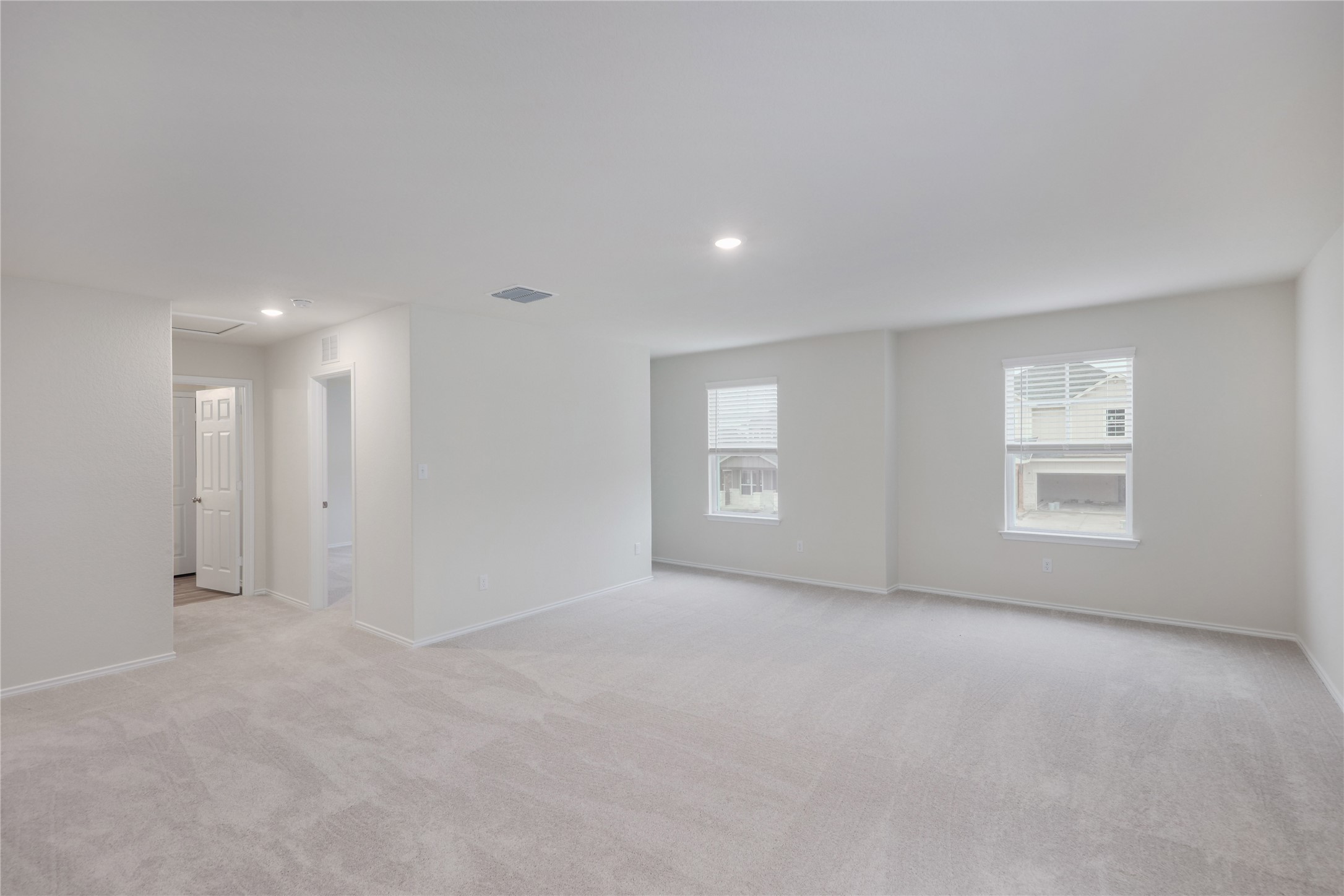 212 Sugar Cane Road Buda, TX 78610 - Photo 17 of 40 a view of an empty room with a window