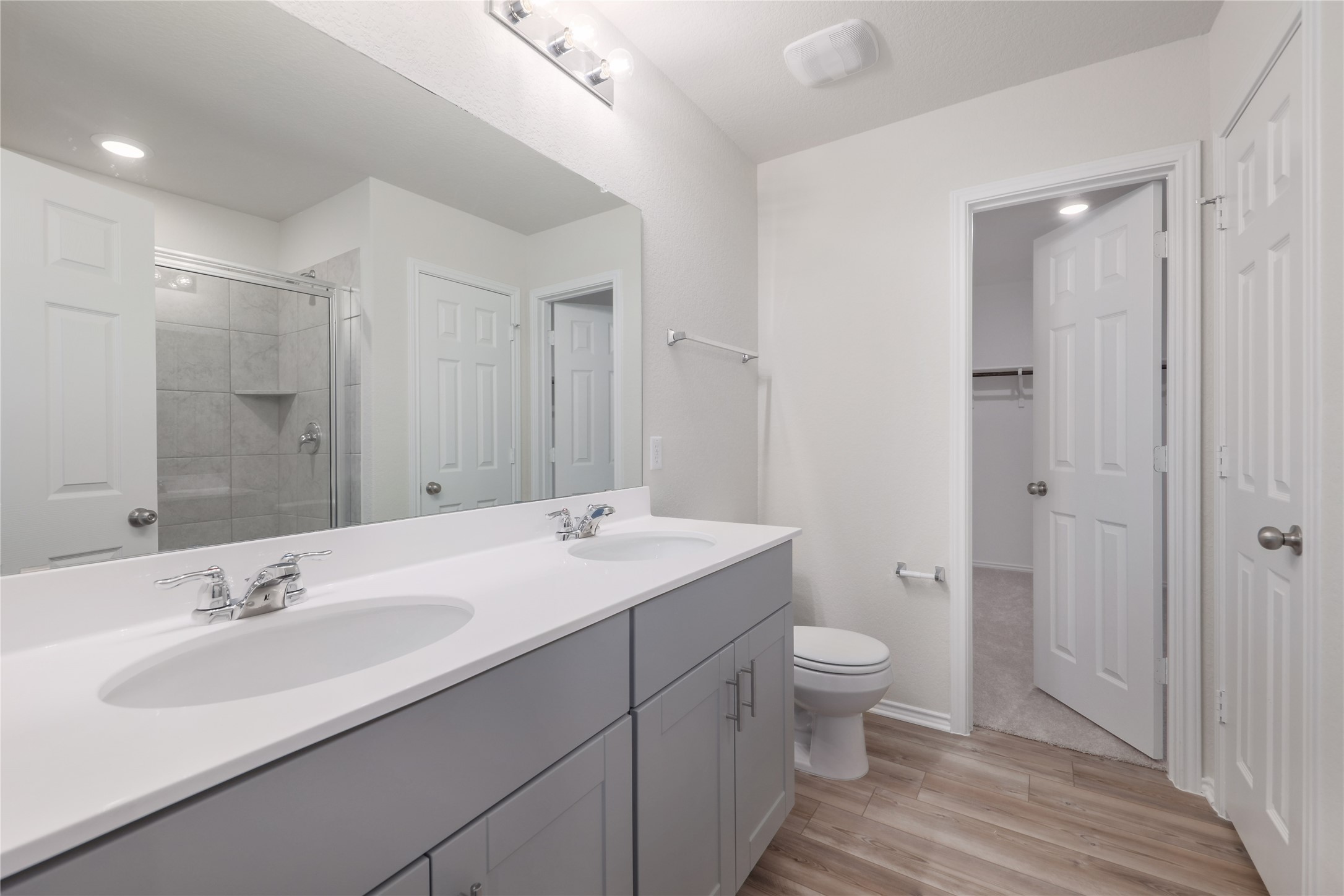 212 Sugar Cane Road Buda, TX 78610 - Photo 23 of 40 a bathroom with a sink a toilet a shower and a mirror