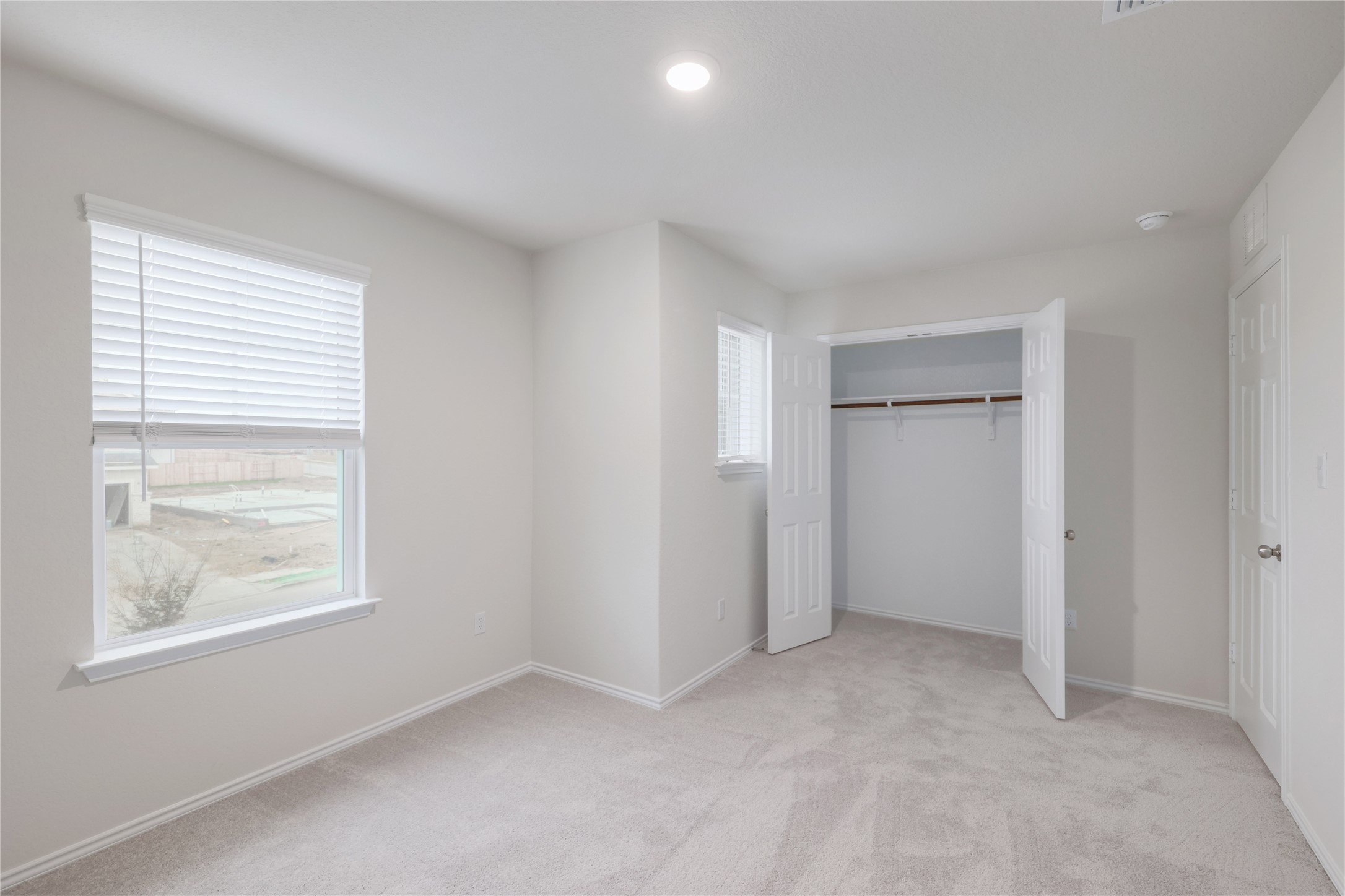 212 Sugar Cane Road Buda, TX 78610 - Photo 27 of 40 a view of an empty room with a window