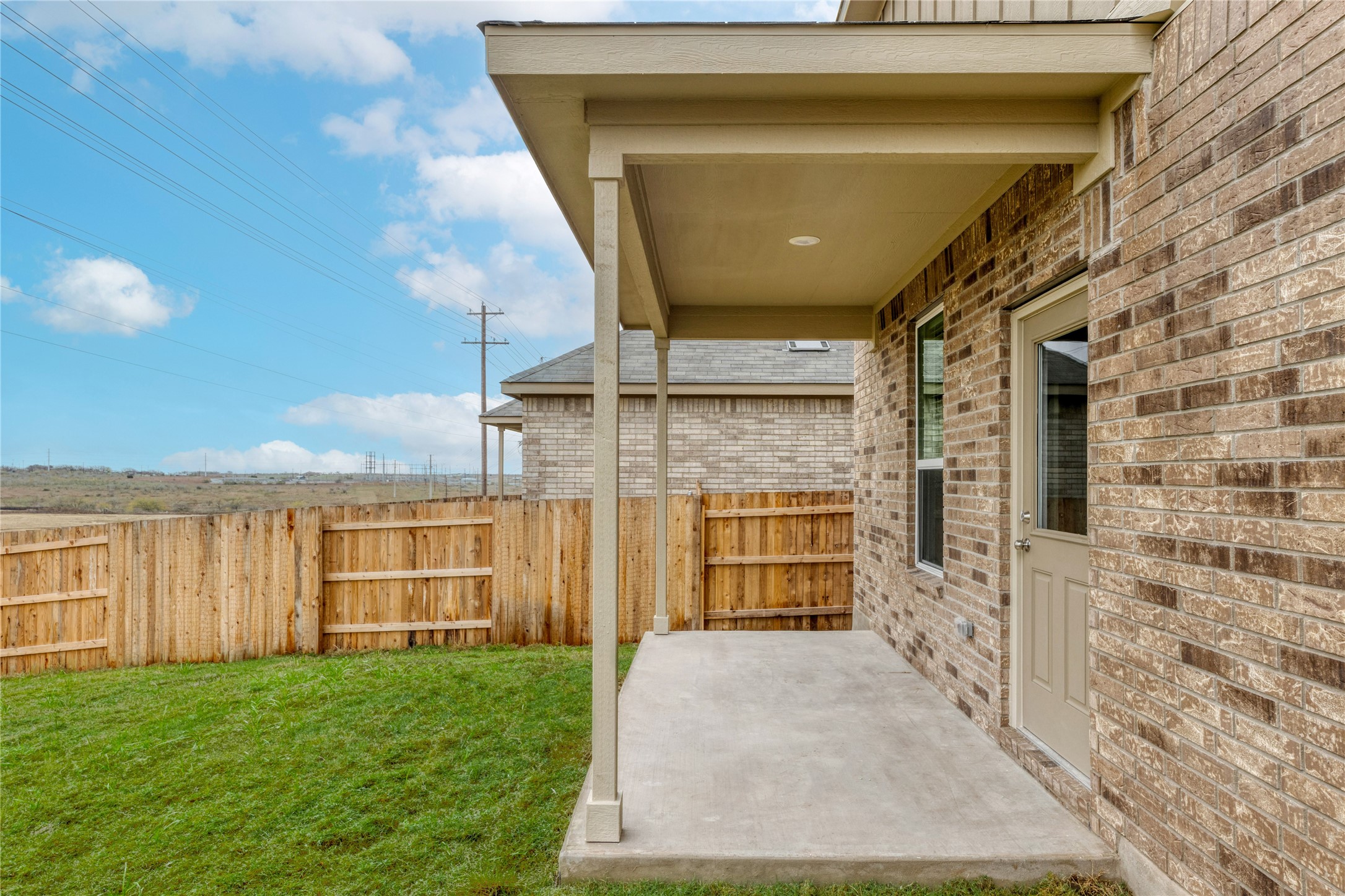 212 Sugar Cane Road Buda, TX 78610 - Photo 32 of 40 a front view of a house with a yard