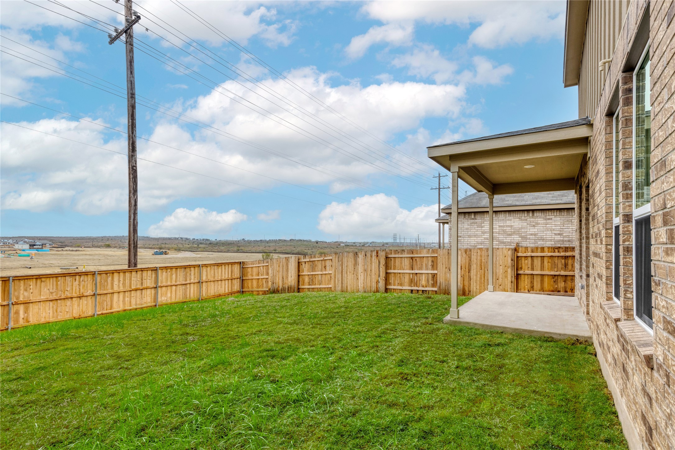 212 Sugar Cane Road Buda, TX 78610 - Photo 34 of 40 a view of a house with a backyard