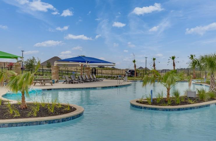 212 Sugar Cane Road Buda, TX 78610 - Photo 36 of 40 a view of a swimming pool with a table and chairs