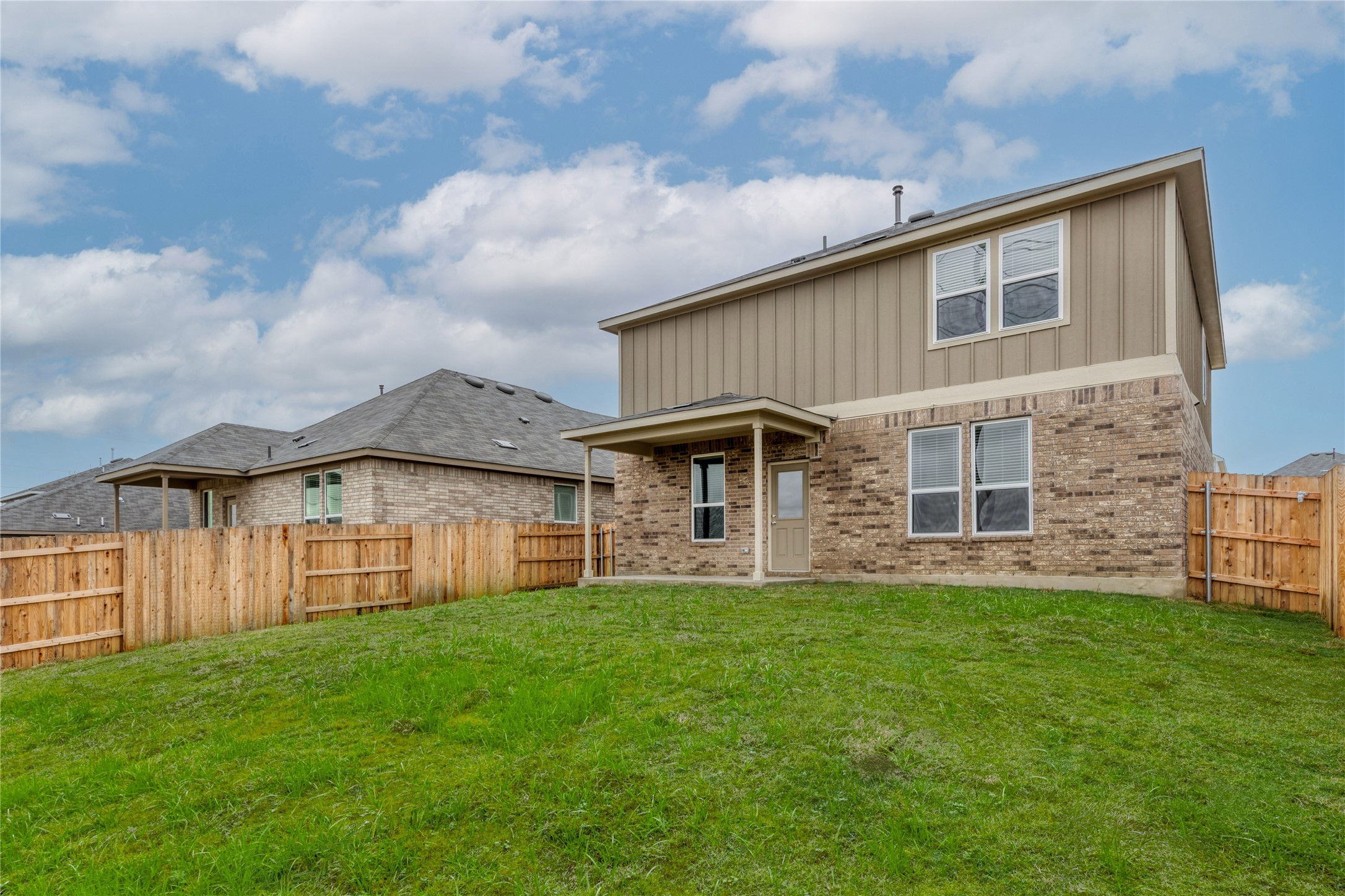 212 Sugar Cane Road Buda, TX 78610 - Photo 4 of 40 a view of a house with a yard and sitting area