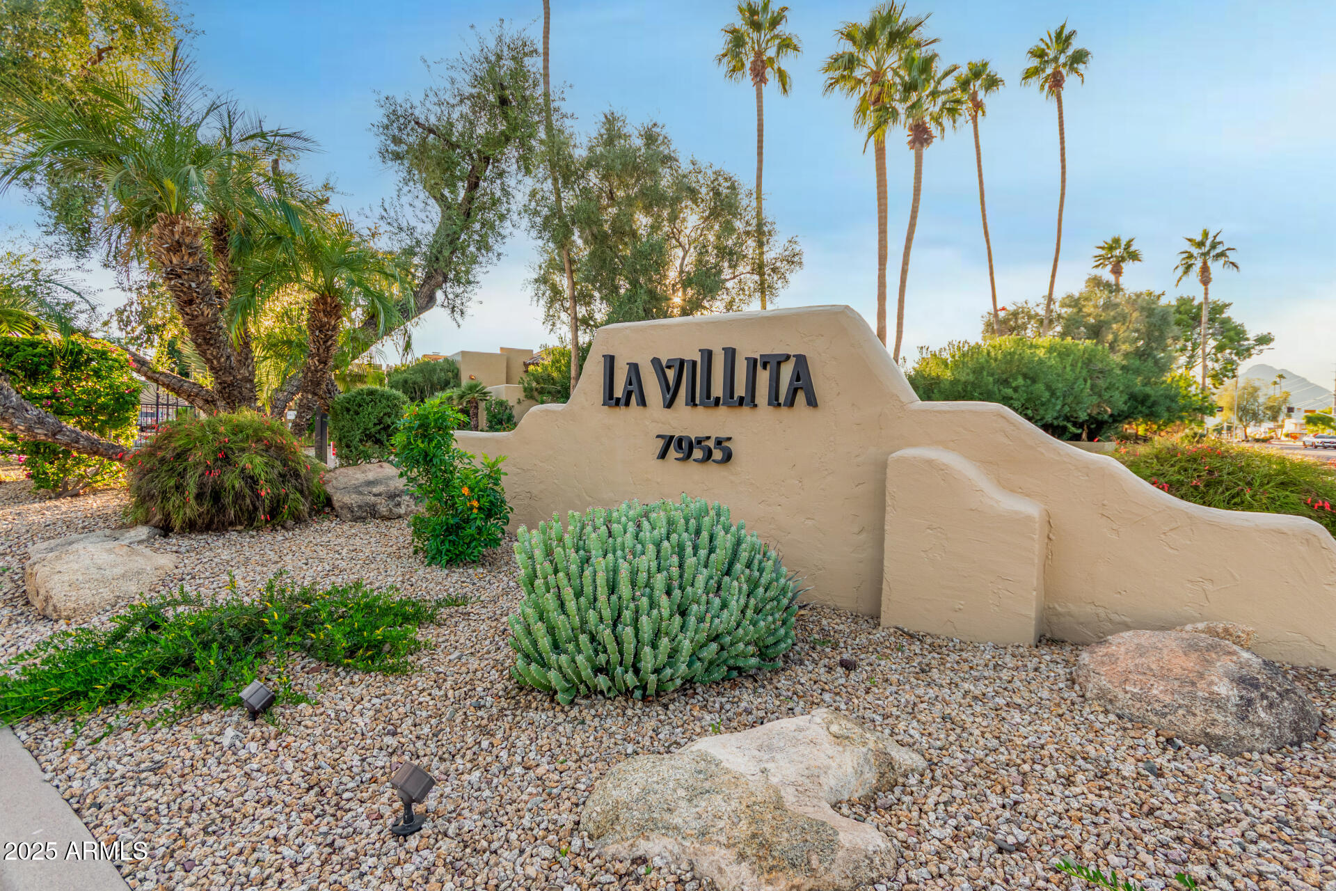 7955 East Chaparral Road, Unit 122 Scottsdale, AZ 85250 - Photo 2 of 29 a sign that is sitting in front of a road