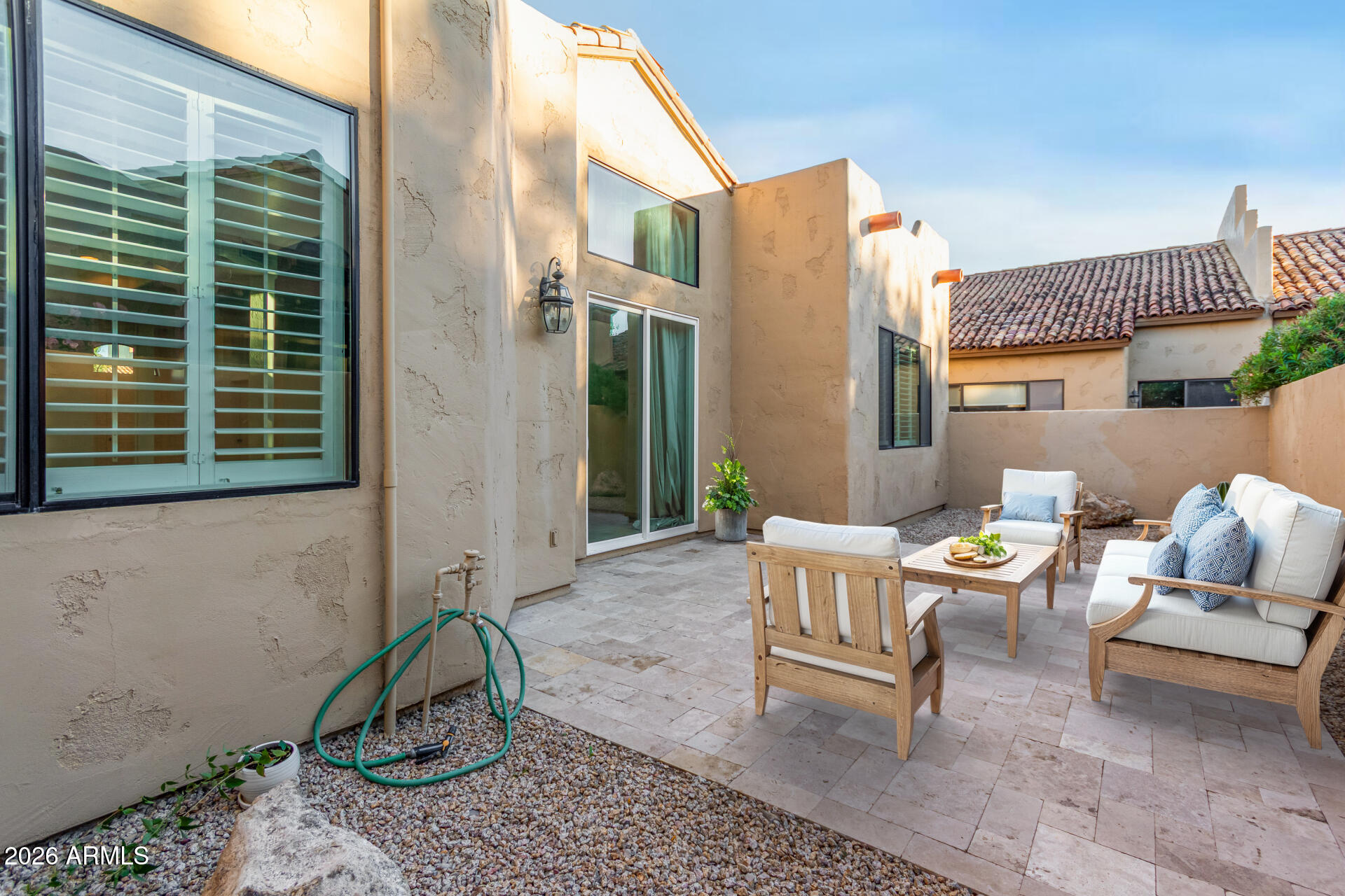 7955 East Chaparral Road, Unit 122 Scottsdale, AZ 85250 - Photo 22 of 29 a backyard of a house with outdoor seating