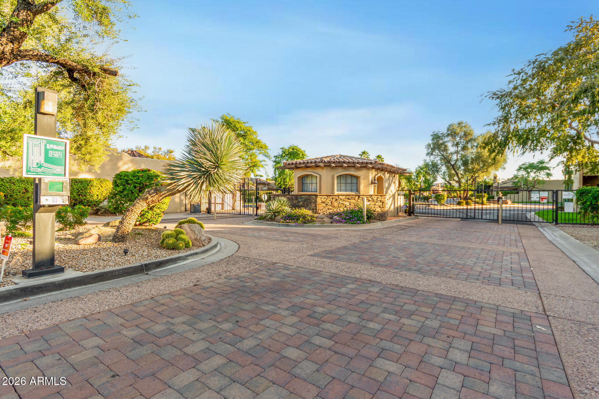 7955 East Chaparral Road, Unit 122 Scottsdale, AZ 85250 - Photo 29 of 29 a view of a city street lined with buildings and trees