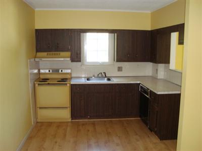 166 Upper County Road, Unit 212 Dennis Port, MA 02639 - Photo 2 of 7 a kitchen with a sink a stove a microwave a sink and a window