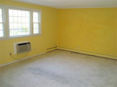 166 Upper County Road, Unit 212 Dennis Port, MA 02639 - Photo 3 of 7 a view of a room with blue walls