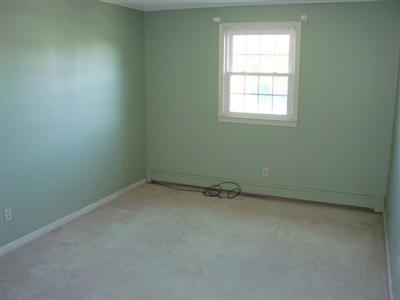 166 Upper County Road, Unit 212 Dennis Port, MA 02639 - Photo 5 of 7 an empty room with a window