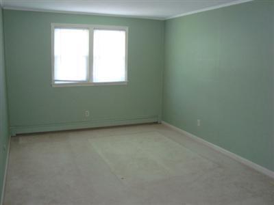 166 Upper County Road, Unit 212 Dennis Port, MA 02639 - Photo 6 of 7 an empty room with a window
