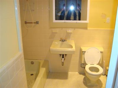166 Upper County Road, Unit 212 Dennis Port, MA 02639 - Photo 7 of 7 a bathroom with a sink and mirror