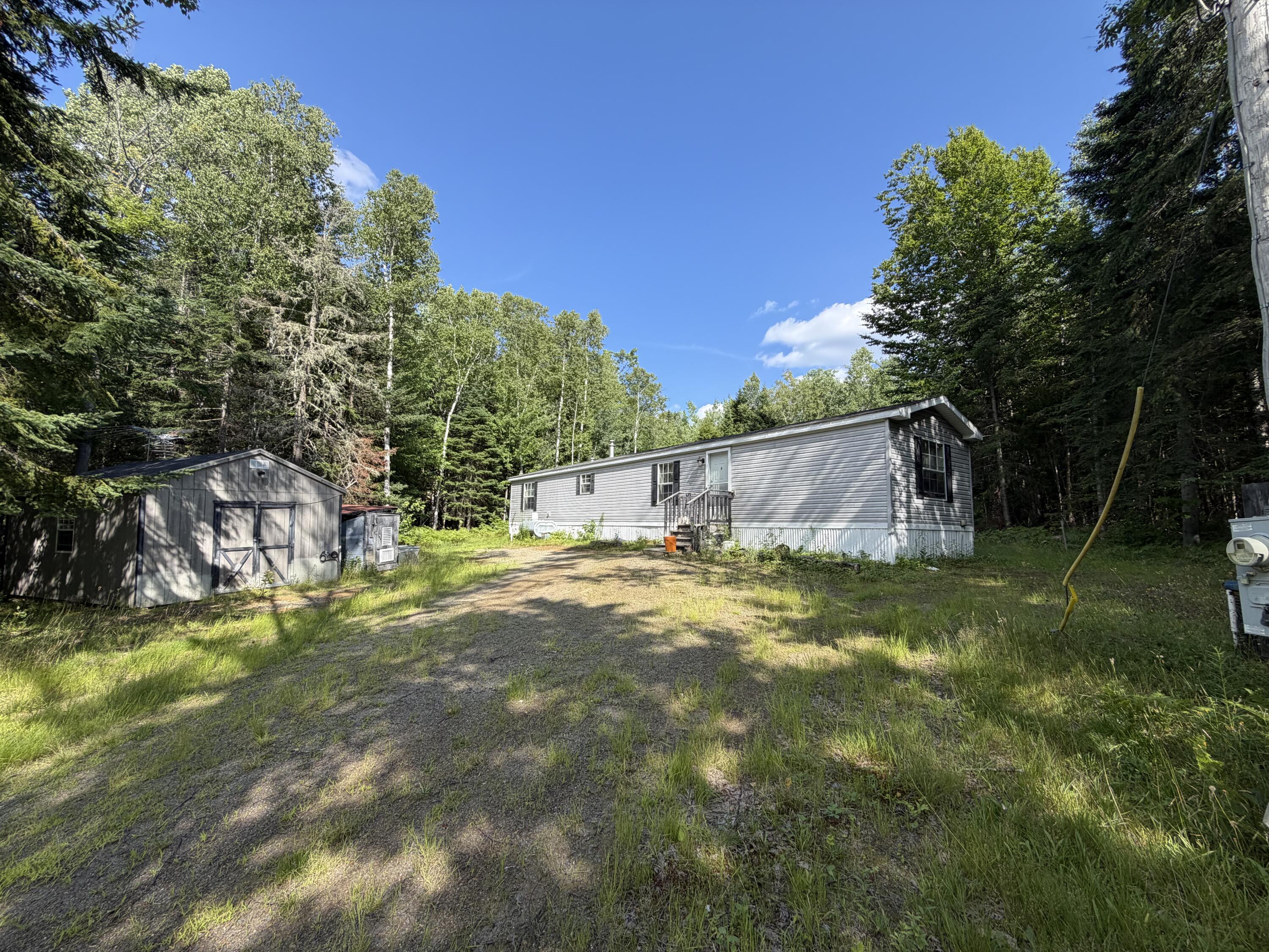 163 Bemis Road Oquossoc, ME 04964 - Photo 1 of 23 IMG_1636