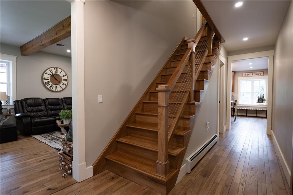 304 Ellermeyer Road Walston, PA 15781 - Photo 15 of 50 a view of a hallway with wooden floor and staircase