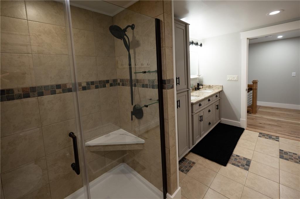 304 Ellermeyer Road Walston, PA 15781 - Photo 19 of 50 a bathroom with a granite countertop sink