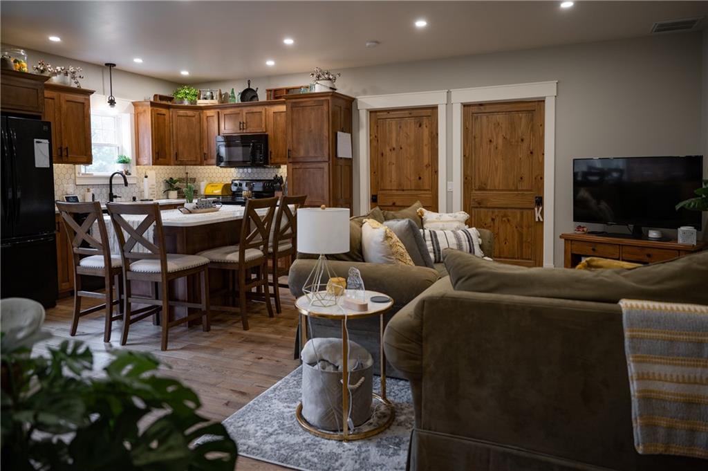 304 Ellermeyer Road Walston, PA 15781 - Photo 34 of 50 a living room with furniture and a flat screen tv