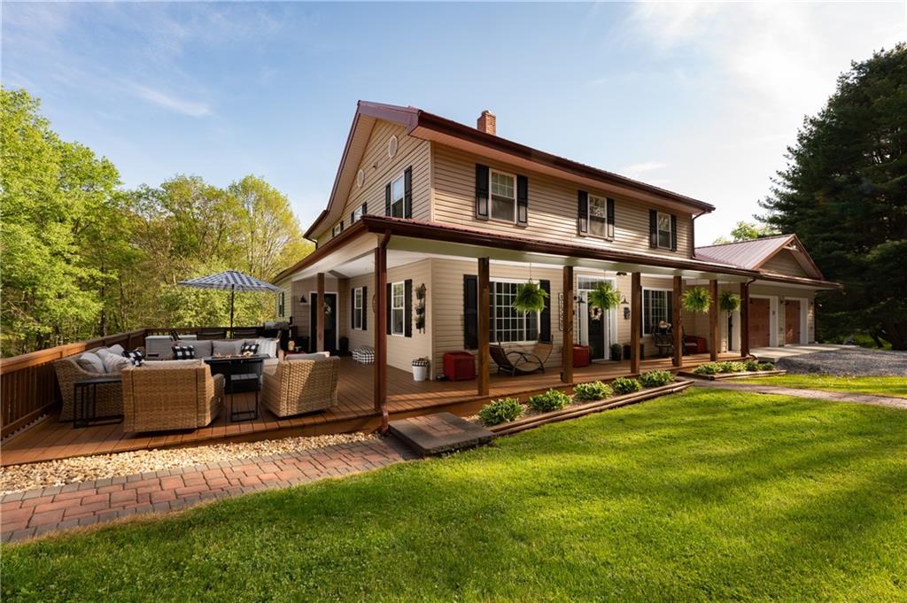 304 Ellermeyer Road Walston, PA 15781 - Photo 41 of 50 a view of a house with swimming pool and sitting area