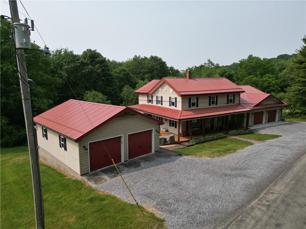 304 Ellermeyer Road Walston, PA 15781 - Photo 50 of 50 a aerial view of a house with a yard and large trees