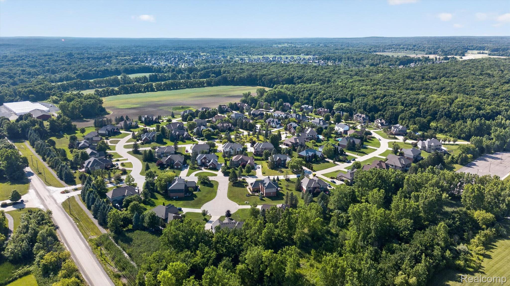 3804 Elk Drive Rochester, MI 48306 - Photo 74 of 75 Expansive residential development featuring curving streets, mature tree lines, and surrounding natural landscapes