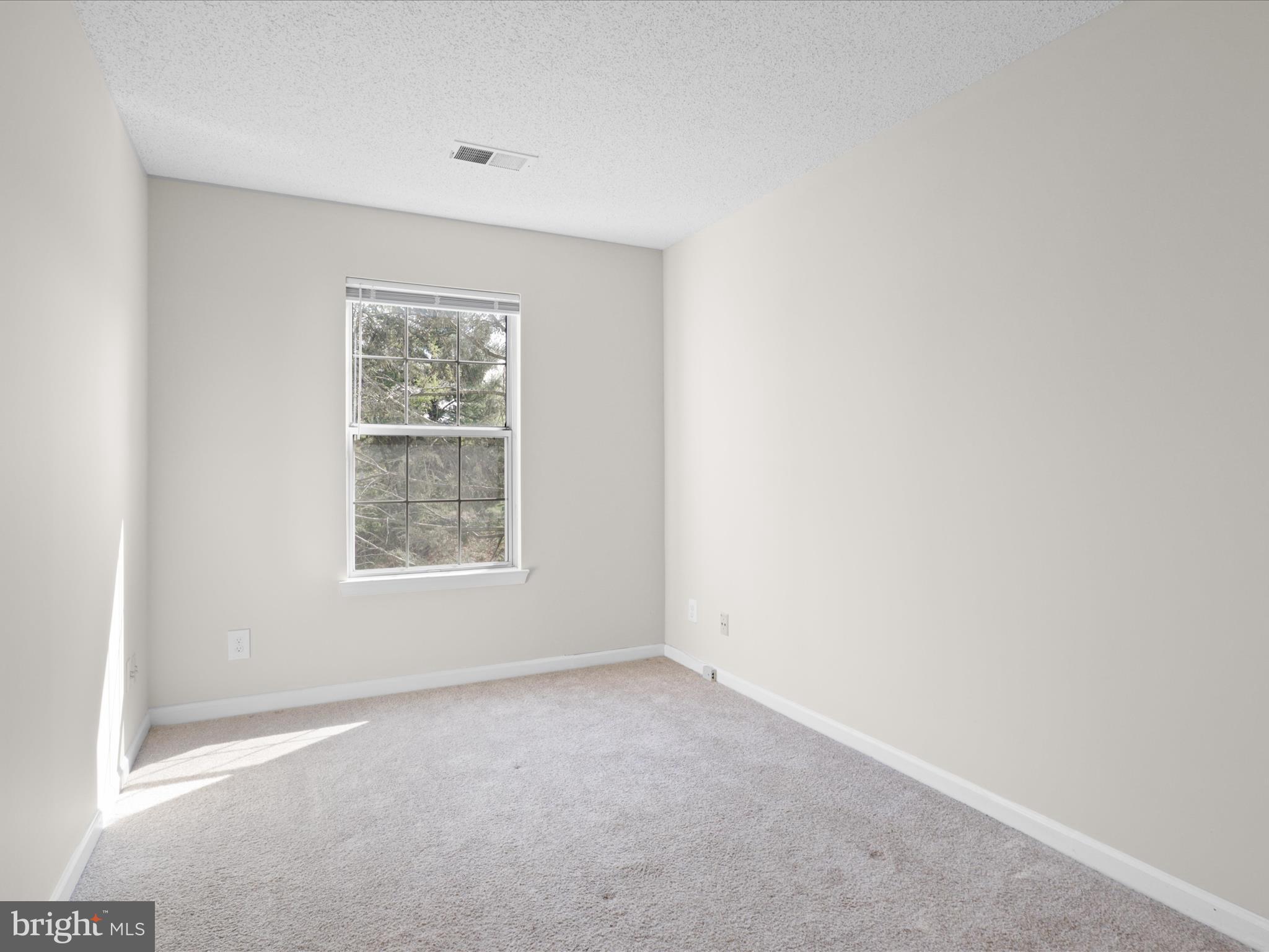 12008 Golf Ridge Court, Unit 356 Fairfax, VA 22033 - Photo 14 of 33 an empty room with a window