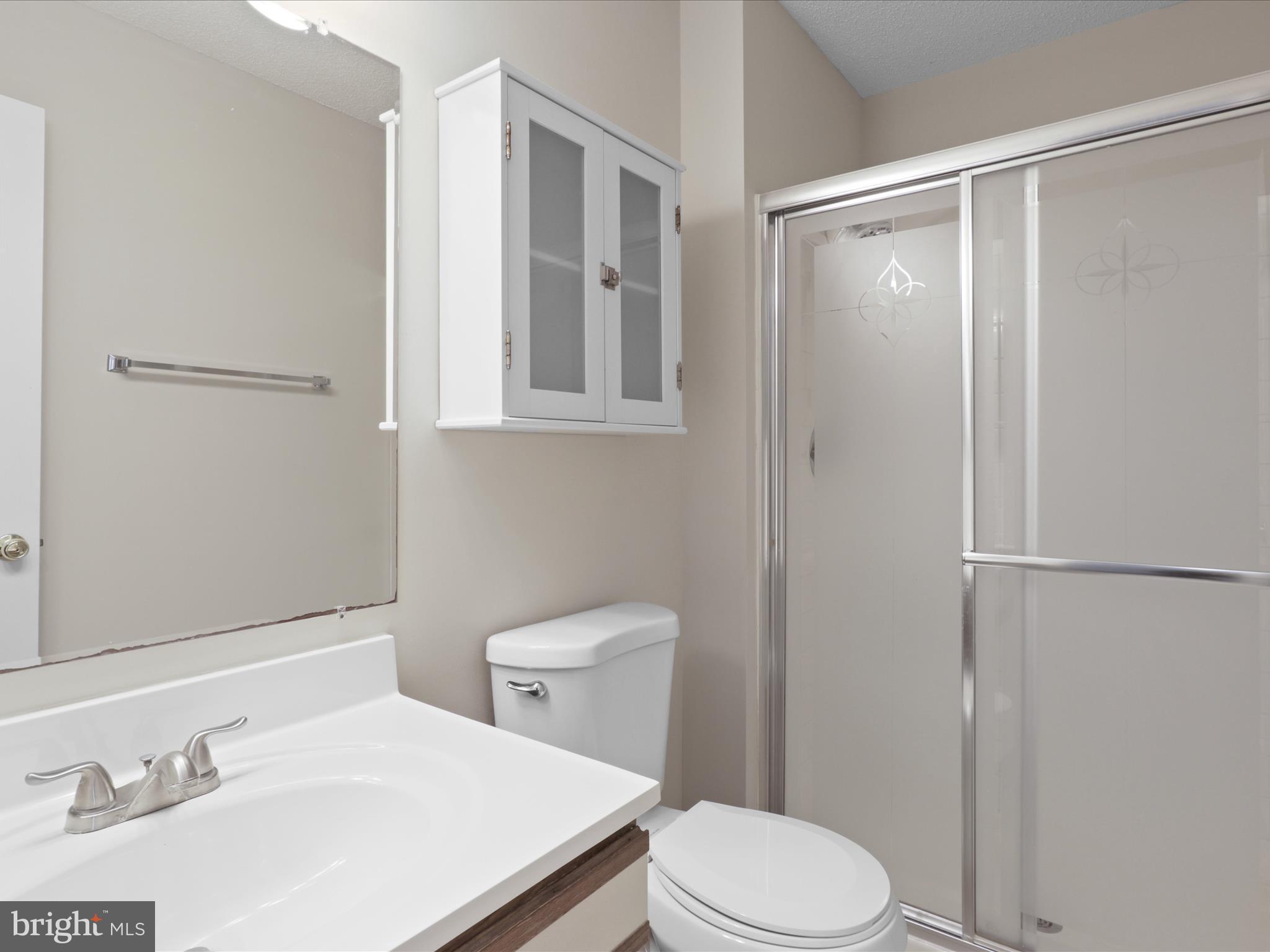 12008 Golf Ridge Court, Unit 356 Fairfax, VA 22033 - Photo 18 of 33 a white toilet sitting next to a bathroom sink