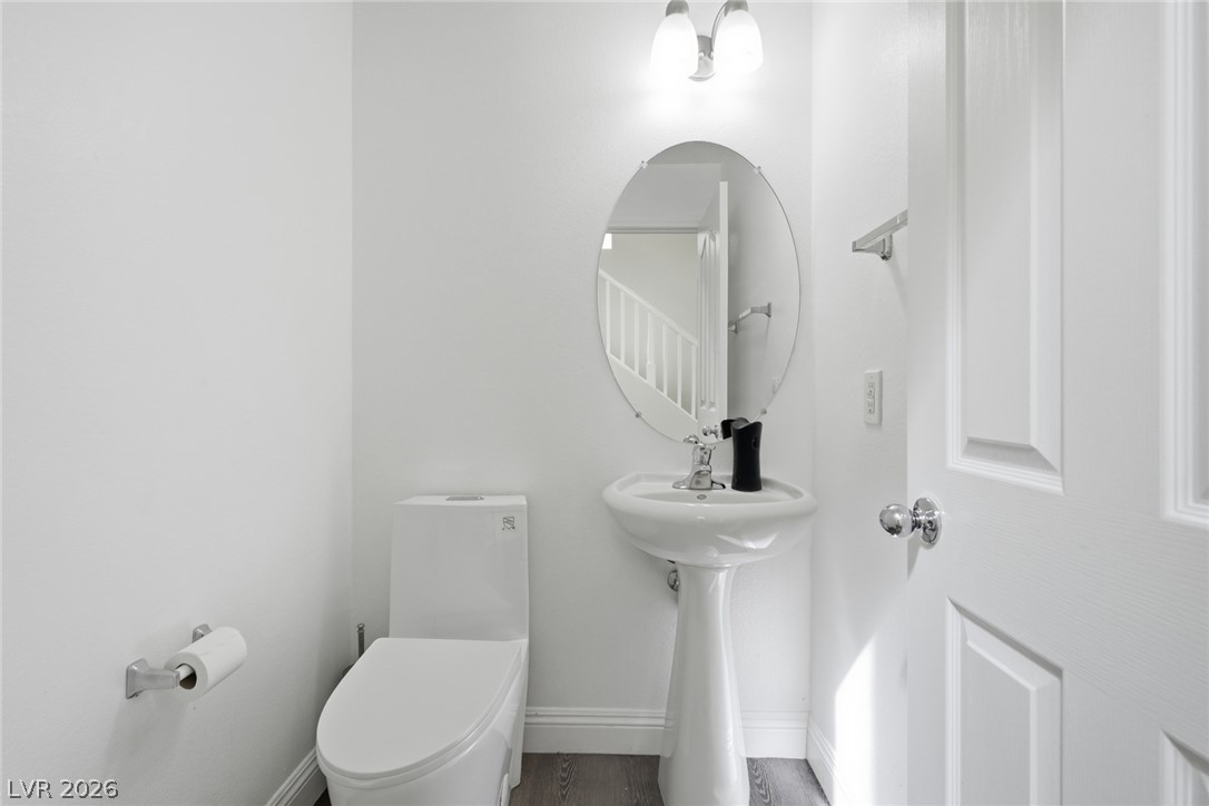 8932 Caledon Ridge Court Las Vegas, NV 89149 - Photo 33 of 39 A classic pedestal sink and clean lines define this modern powder room.