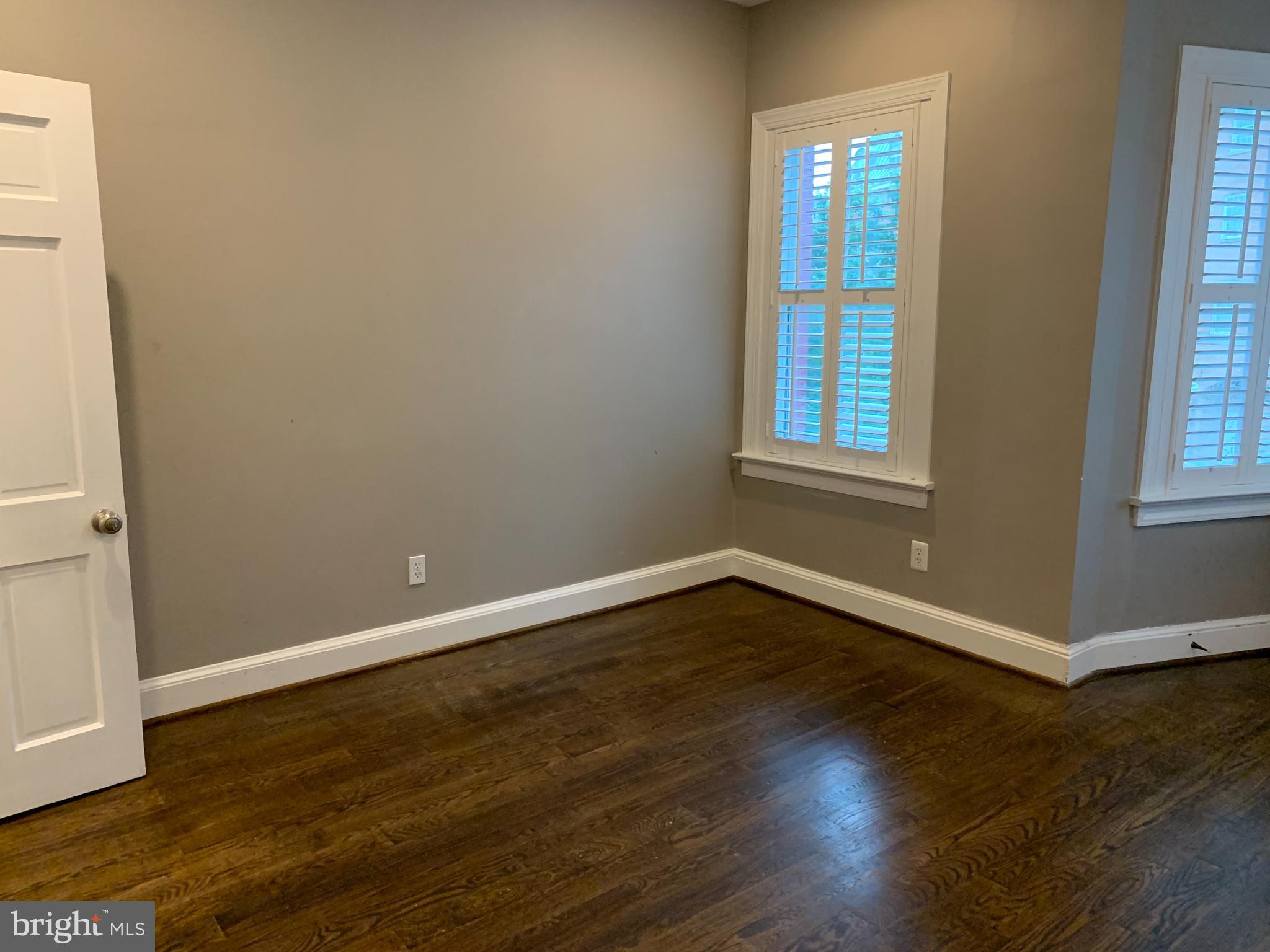 612 C Street Southeast Washington, DC 20003 - Photo 8 of 20 an empty room with wooden floor and windows