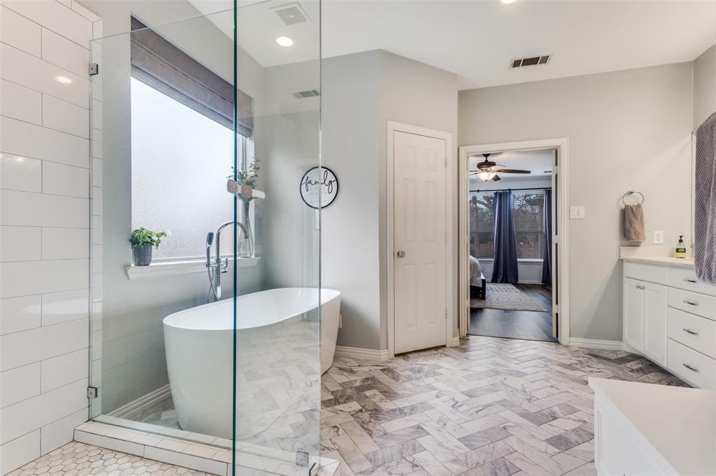 1524 Rustic Timbers Lane Flower Mound, TX 75028 - Photo 13 of 28 a living room with a bed and a dresser