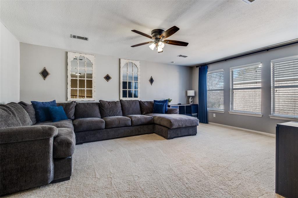 1524 Rustic Timbers Lane Flower Mound, TX 75028 - Photo 16 of 28 a living room with furniture and a large window