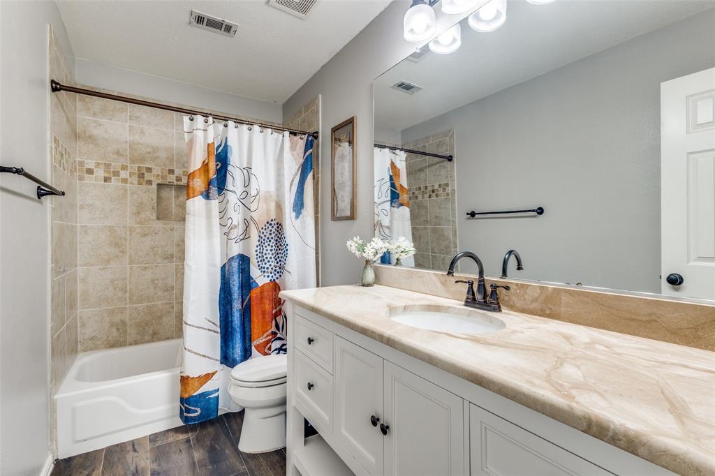 1524 Rustic Timbers Lane Flower Mound, TX 75028 - Photo 18 of 28 a bathroom with a sink toilet and shower