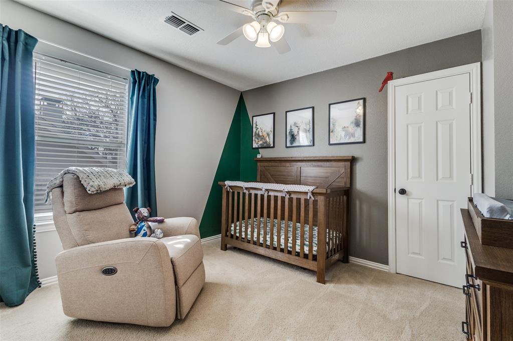 1524 Rustic Timbers Lane Flower Mound, TX 75028 - Photo 19 of 28 a bedroom with furniture and a window
